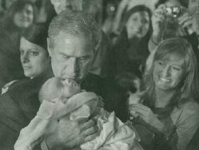 President Bush holds snowflake baby, Trey Jones President Bush holds snowflake baby, Trey Jones